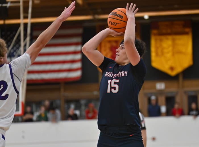 Montgomery's JJ Sanchez shoots over the reach of Carlsbad's Jett Kenady in December's matchup